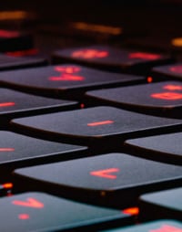 Black keyboard with red letters.